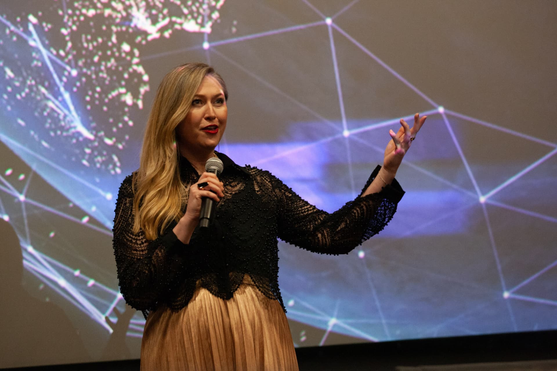 Nicole Buratovich introducing the film in front of the globe projection