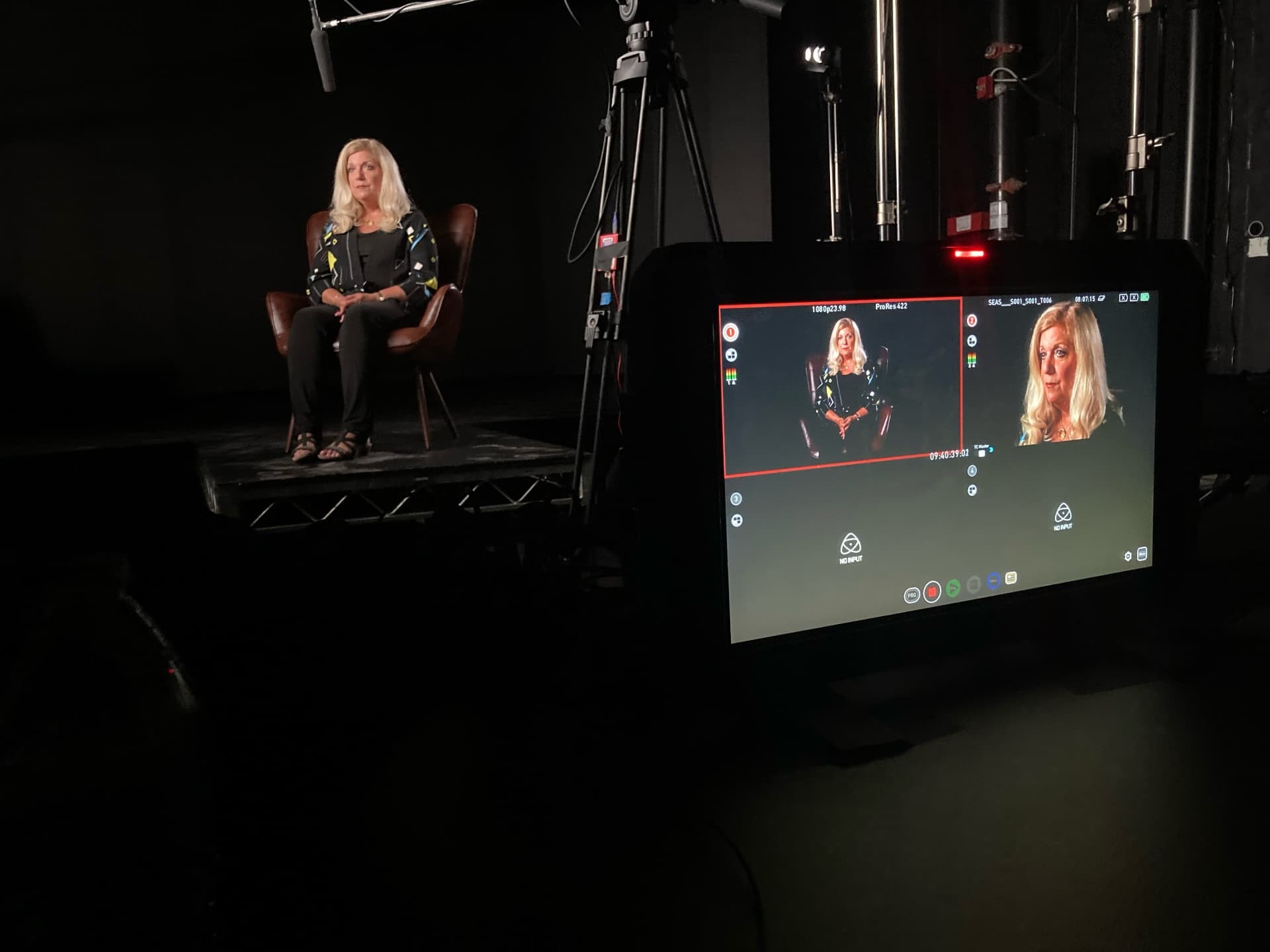 An interview being filmed at the 2024 Women In Security conference, with the camera monitor in the foreground